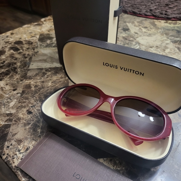 Red sparkle Louis Vuitton sunglasses with the gold symbols on both arms. - Picture 2 of 5
